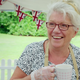 Contestant Linda drinking from a mug and smiling